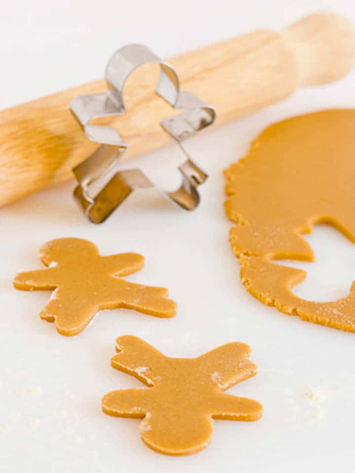 Rolled out gingerbread dough with shapes cut out