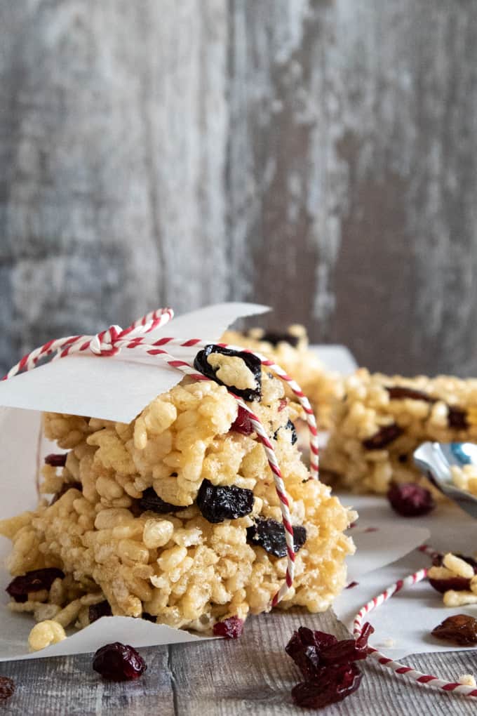 Rice Krispie cereal bar with dried fruit wrapped in baking paper