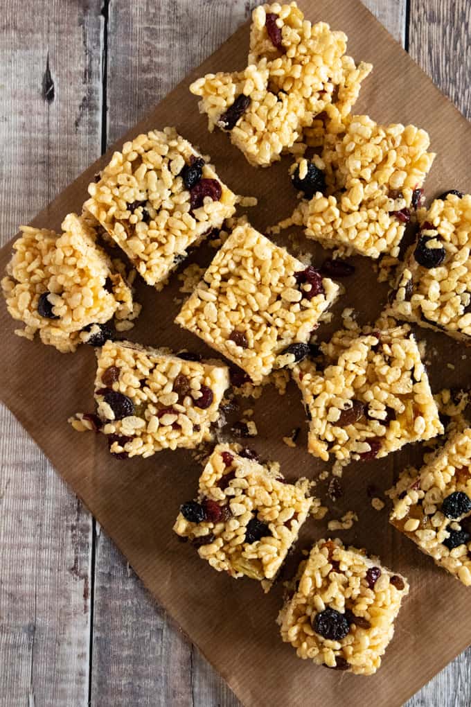 Squares of cereal bars on greaseproof paper