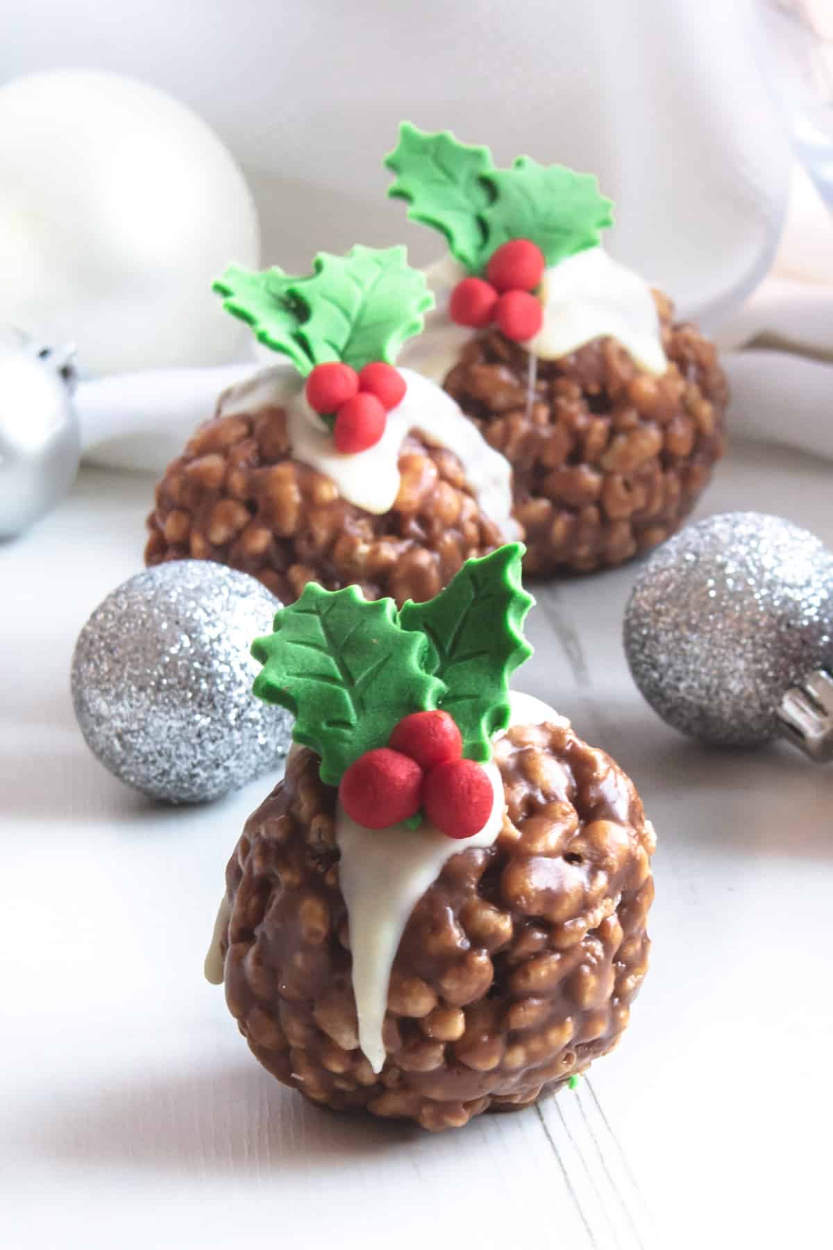 Chocolate cereal balls decorated as Christmas Puddings