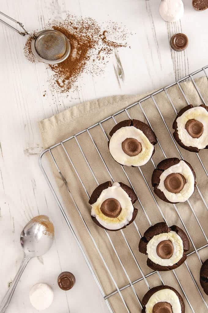 Soft chewy hot chocolate cookies, with a gooey marshmallow and a melty chocolate caramel topping them off. The best hot chocolate you'll ever have!