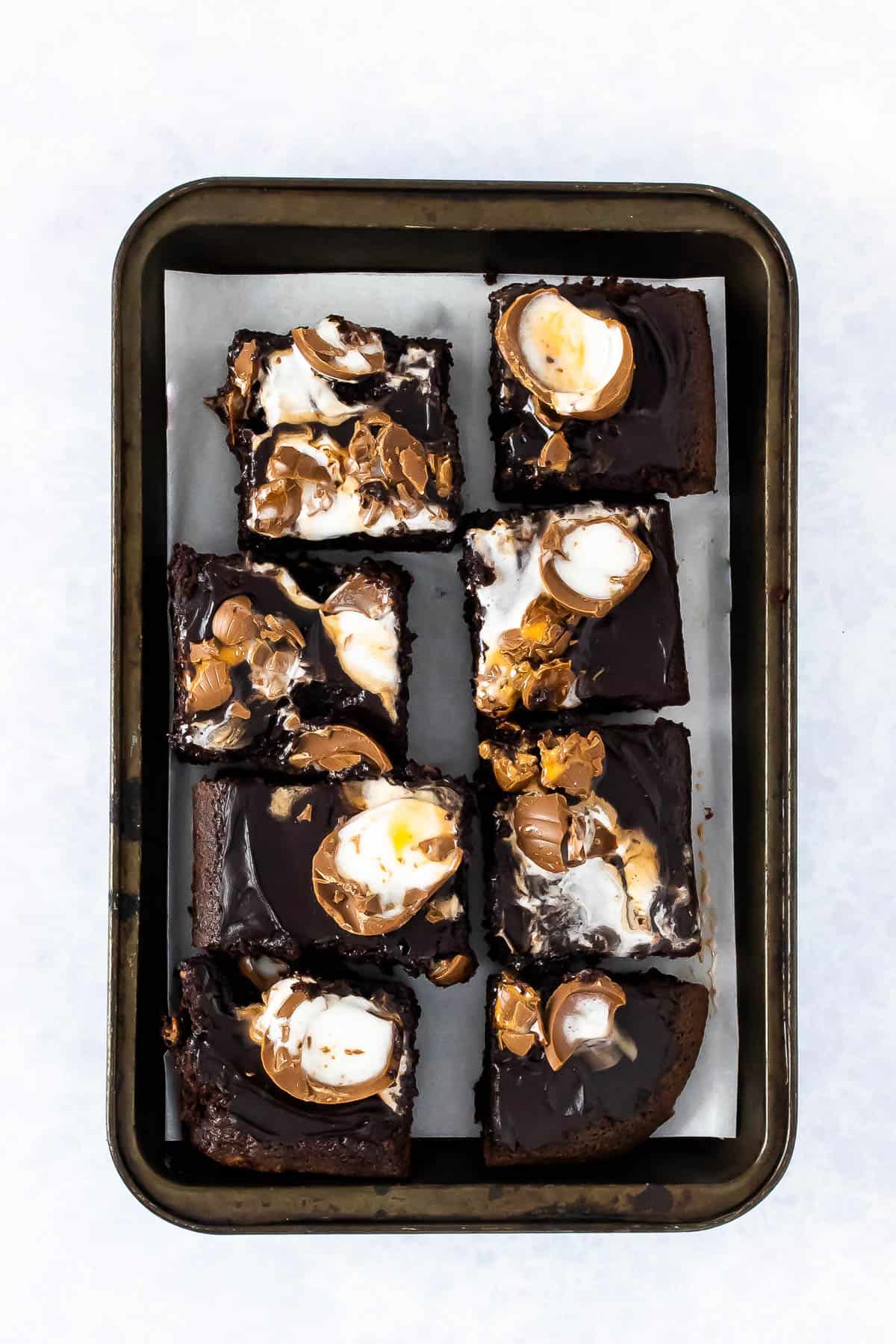 Bake up a gooey chocolate delight for Easter with this Creme Egg traybake. Moist and rich chocolate cake, coated in a chocolate icing and smashed Creme Eggs on top.