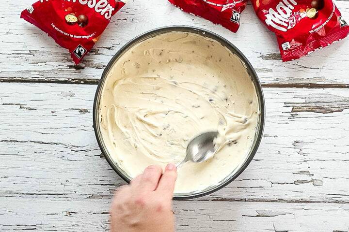 Smoothing cheesecake filling with a spoon