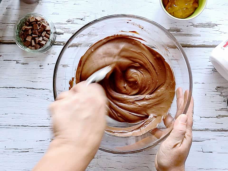 Mixing a chocolate cream with a spatula