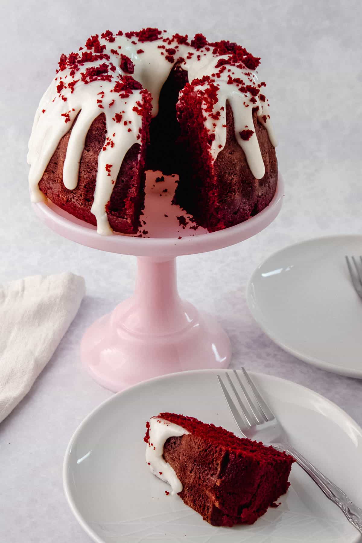 Red Velvet bundt cake with a slice cut out of it