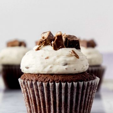 Kit Kat cupcake with frosting and biscuit pieces on top