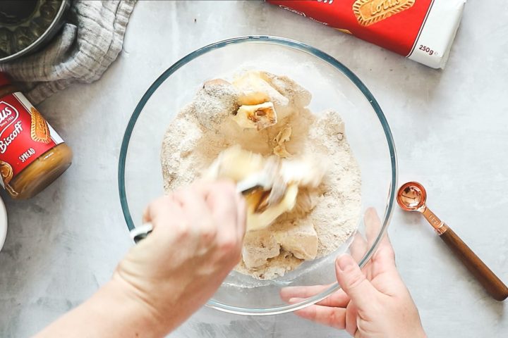 Stirring butter into cake ingredients with a silicone spatula