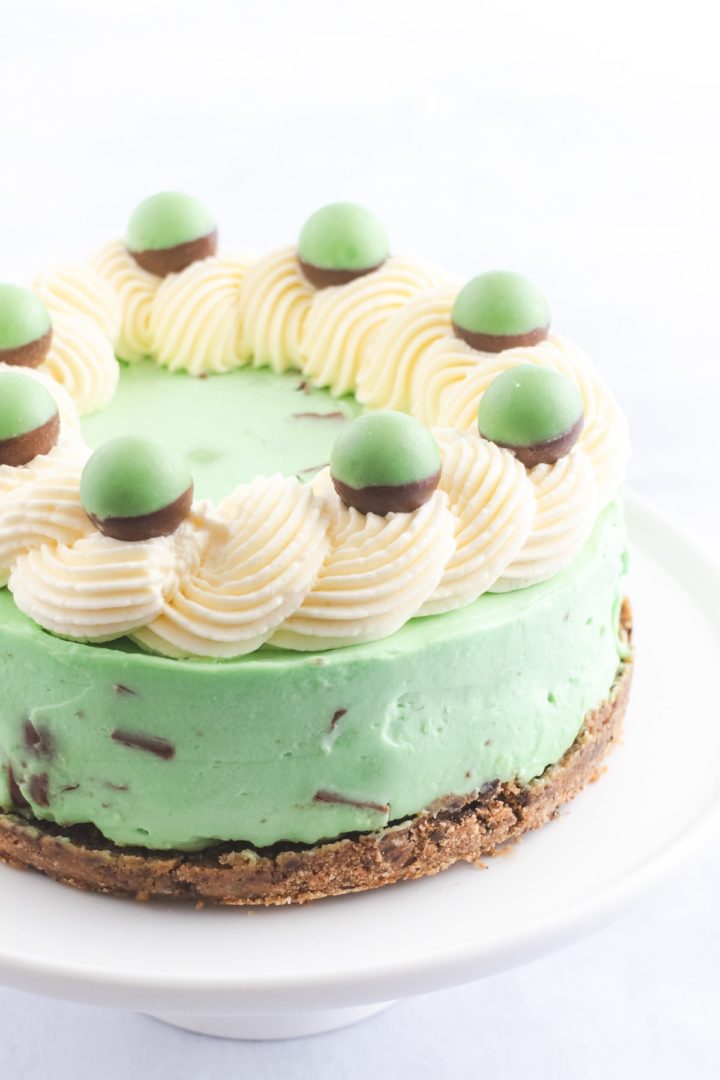 Close up of a mint green cheesecake decorated with Mint Aero bubble chocolates