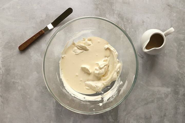 Cream in a large mixing bowl