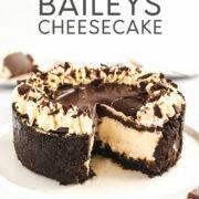 Baileys Irish Cream cheesecake topped with chocolate ganache on a plate - Pinterest image