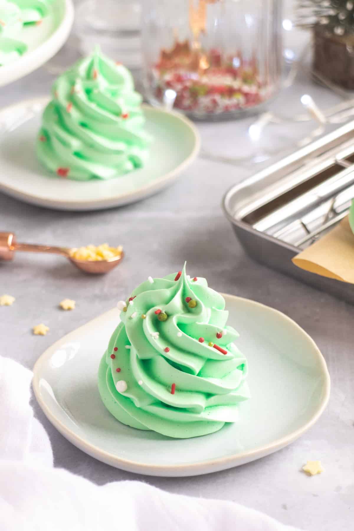 Green meringue swirls with red and white sprinkles