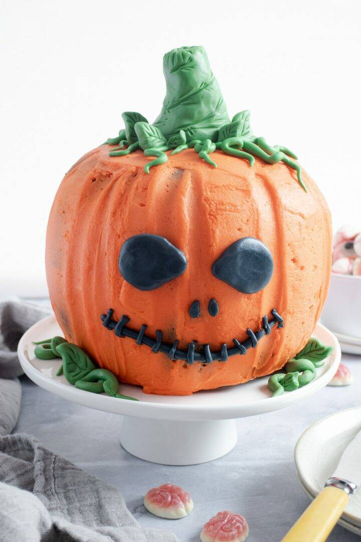 Halloween Pumpkin Cake on a white cake stand