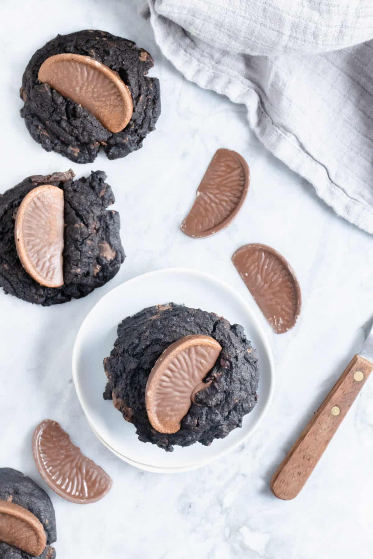 Dark chocolate cookies with an orange segment on top