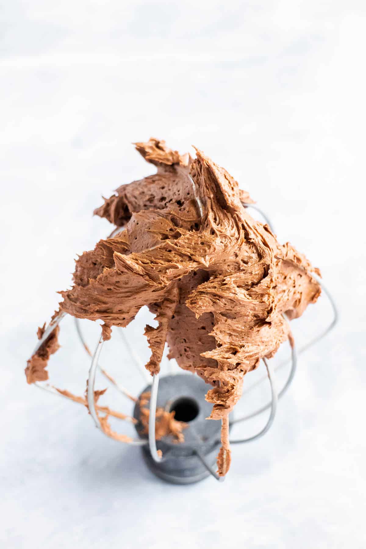 Chocolate buttercream on a whisk