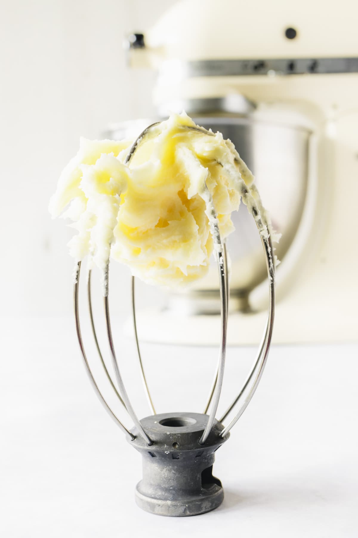 Cream cheese buttercream on a stand mixer whisk attachment