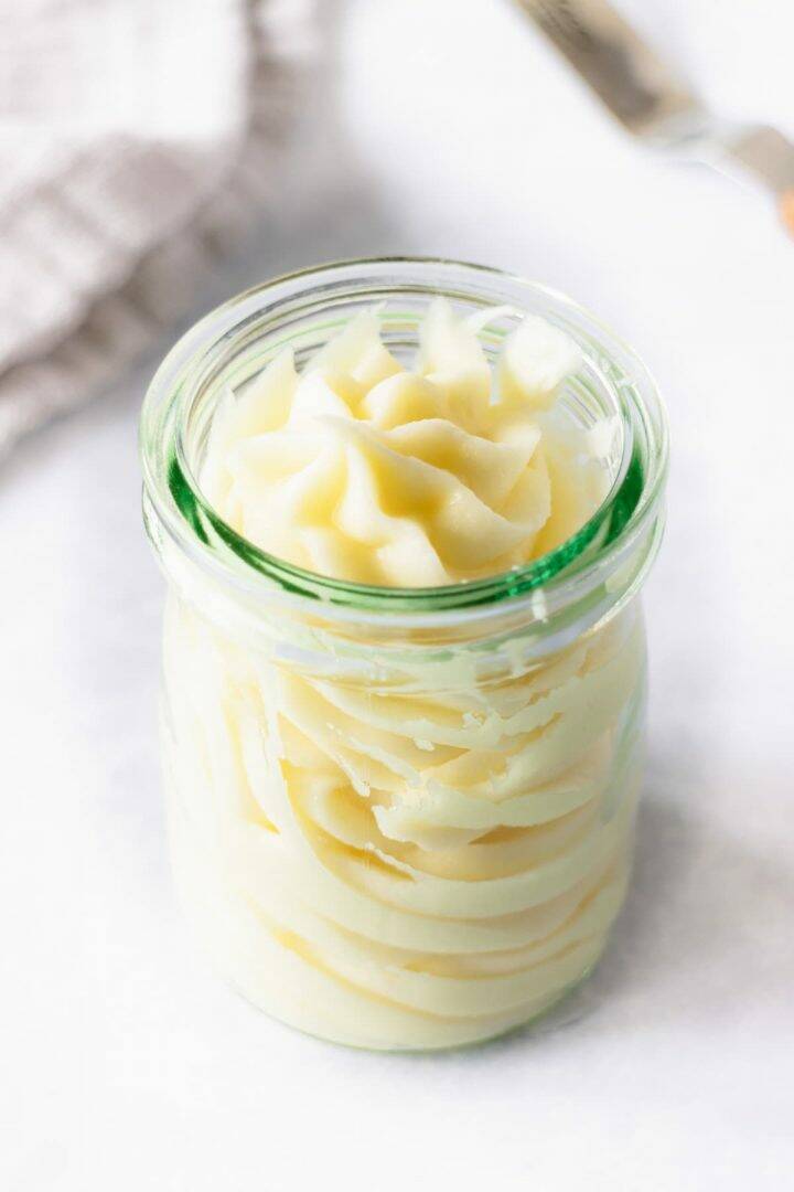 Cream cheese frosting in a glass jar