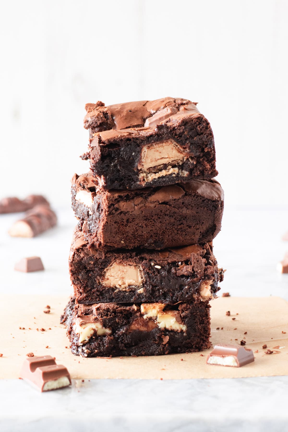Stack of four chocolate brownies with hazelnut cream filling inside