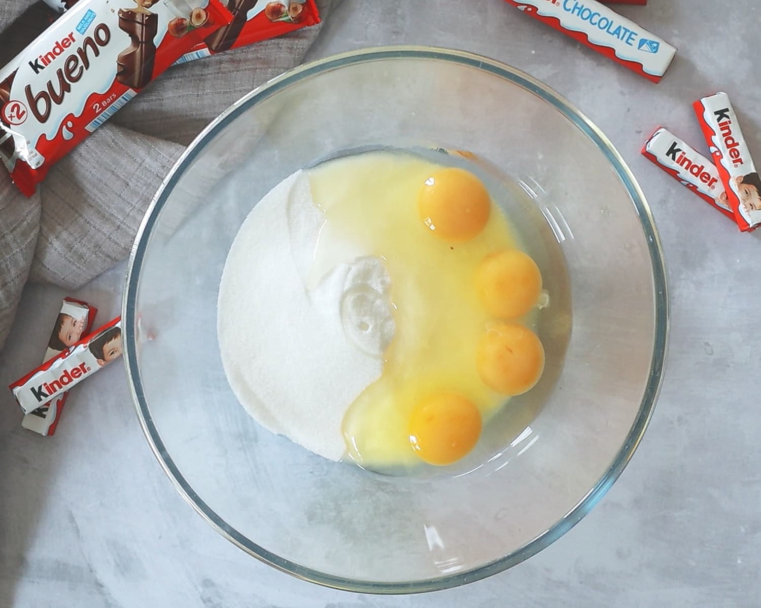 Eggs and sugar in a mixing bowl