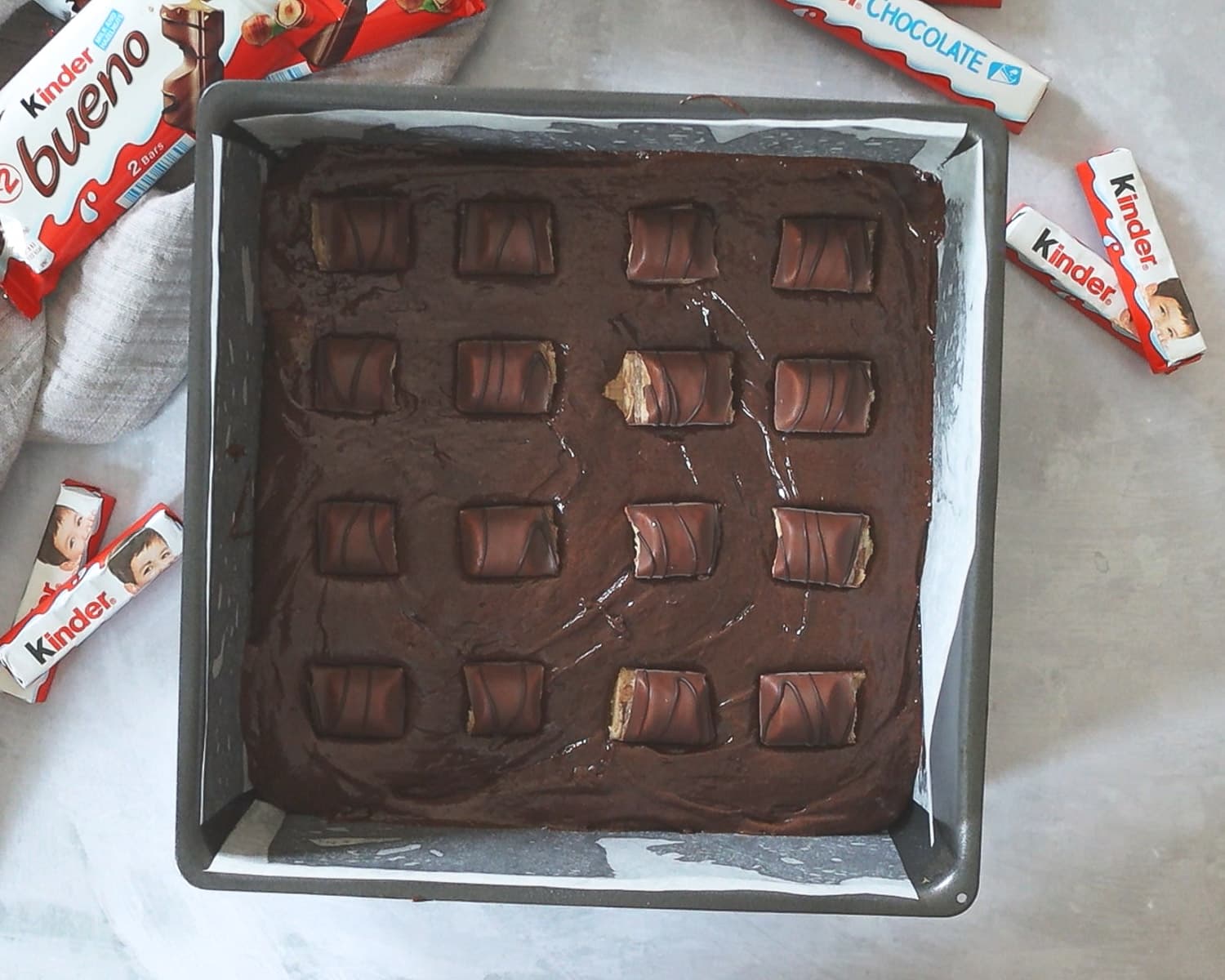 Bueno pieces on top of a layer of brownie batter