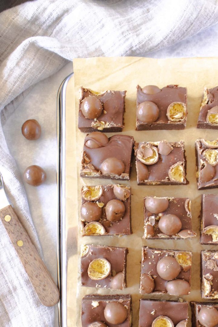 Malteser fudge pieces on a baking tray, seen from above