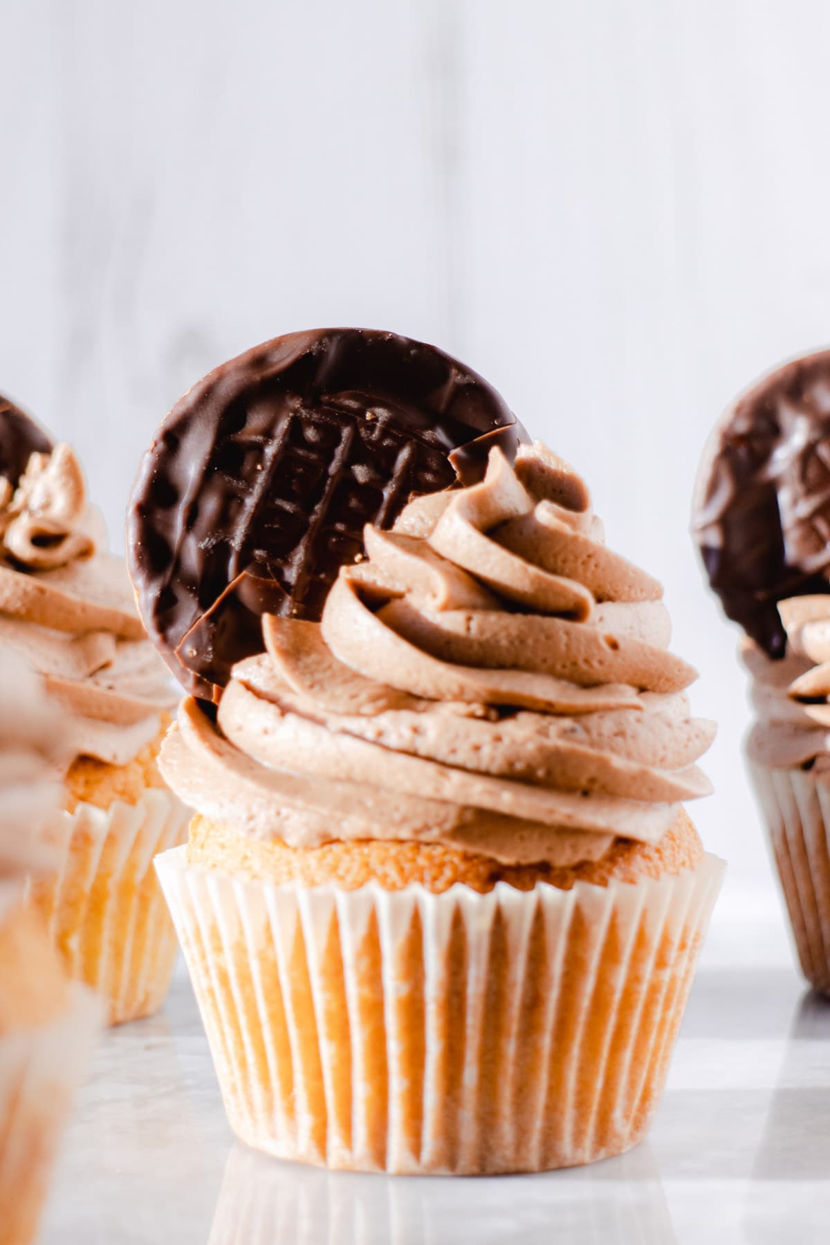 Cupcake topped with chocolate orange buttercream frosting