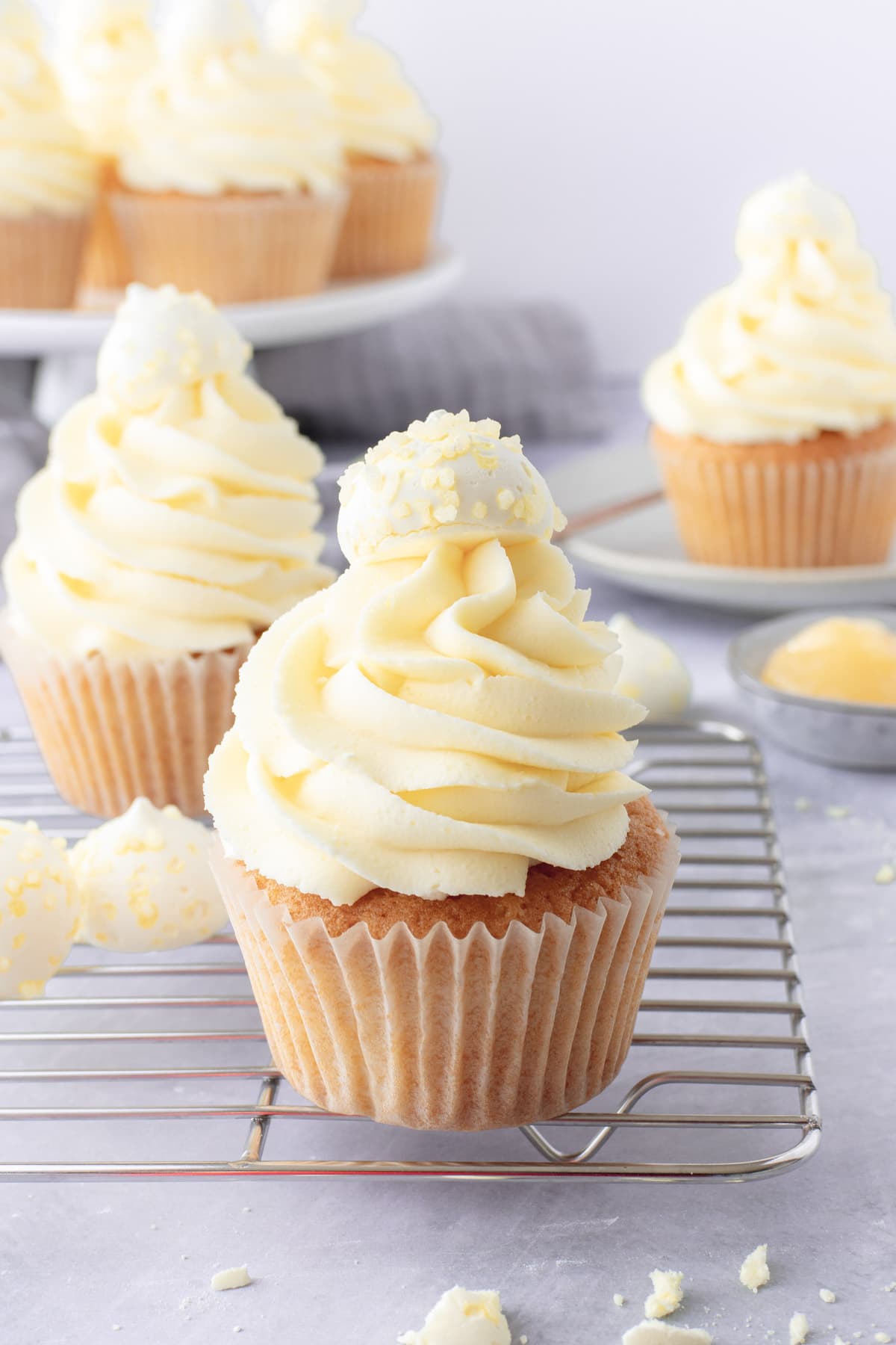 Cupcakes topped with lemon yellow buttercream swirls