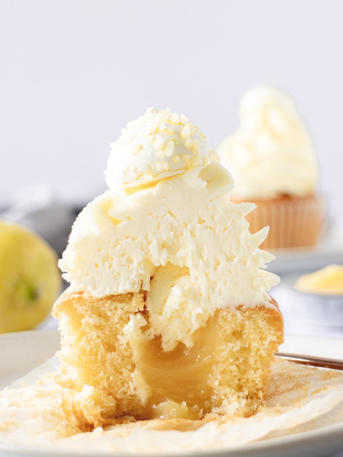 Cupcake cut in half to see a lemon curd filling