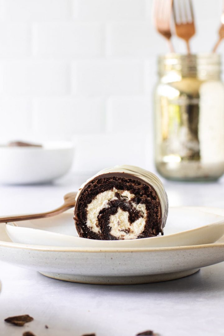 Close up of the swirl inside a chocolate cake roll, filled with a cream filling