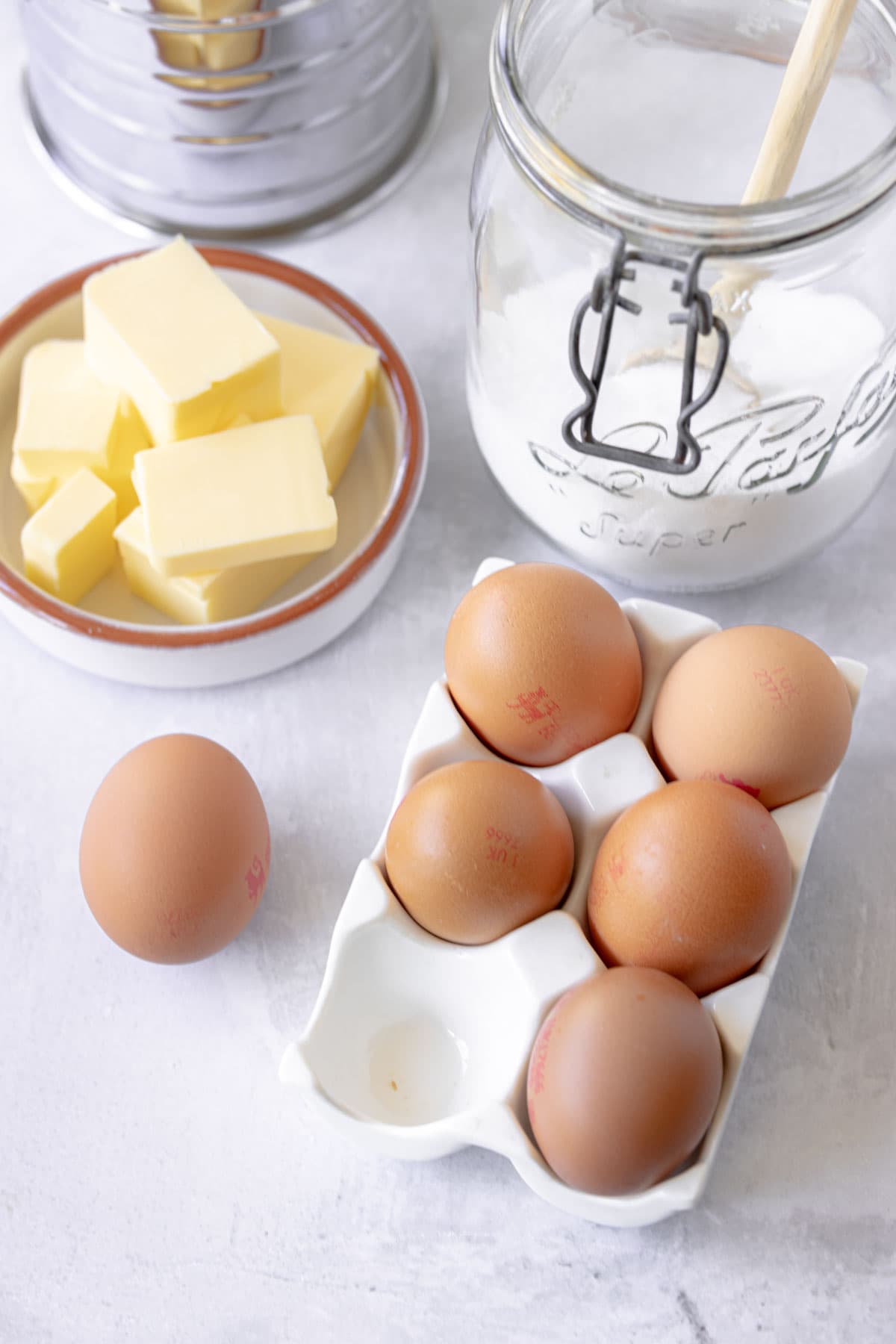 Eggs in a white ceramic egg tray